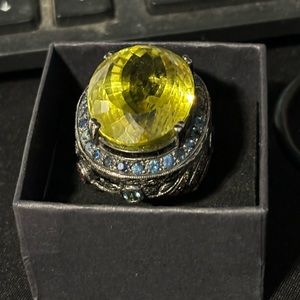 Peridot set in 925 Silver Surrounded by sapphires and other real gems.size 8.25